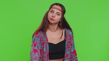 Quarrel. Displeased young woman gesturing hands with irritation and displeasure, blaming scolding for failure, asking why this happened. Hippie girl isolated on chroma key background, green screen video