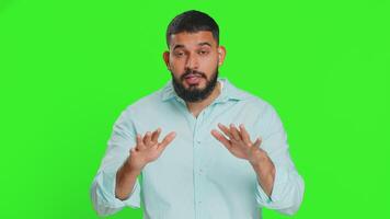 Hey you, be careful. Strict Indian man warning with admonishing hands gesture, saying no, be careful, scolding and giving advice to avoid danger, disapproval sign. Guy on green chroma key background video