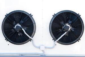 The air conditioning system is assembled on the side of the building photo