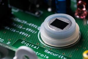 Close-up of the motion sensor of security systems on the electronic board. photo
