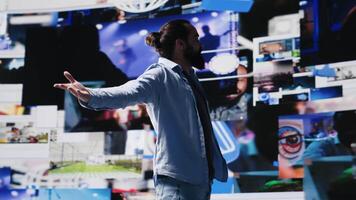 Ambitious confident guy admires the user interfaces on social media apps, connecting with a global audience through mobile technology. using digital tools for entertainment. Camera A. video