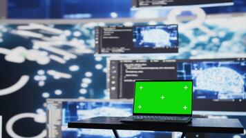 Surrounded by data and neural networks systems, laptop in empty space shows copy space screen for artificial intelligence automation and development. High tech data visualization. Camera B. video