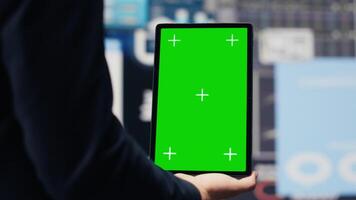 Entrepreneur using isolated mockup screen for a digital analysis, ensures financial planning and business success with digital growth driven tools and monthly reports. Insightfulness. Camera A. video