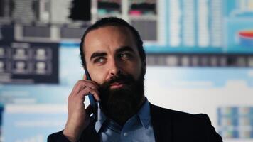 Modern leader on a phone line call discusses fintech and technology strategy. Using business data, visualization tools and forecasting models to drive investment performance. Camera A. video