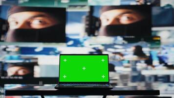High tech military control center with a laptop showcasing isolated display, armed forces tactics and satellite surveillance used to gather data for war planning. Global operations. Camera B. video