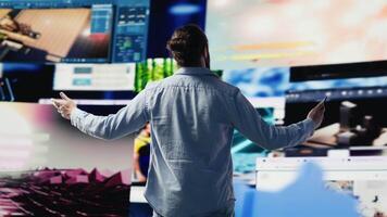 Male influencer checking mobile notifications and visual storytelling, engaging with followers on social network and showcasing creativity. Connected digital world, brand voice. Camera A. video