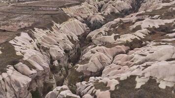 Deep valleys and eroded rock formations in Cappadocia video