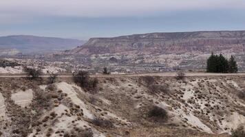 Aerial view of eroded rock formations and valleys in Cappadocia video