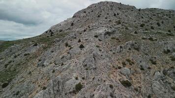 Rocky summit near Sagalassos with sparse vegetation seen from air video