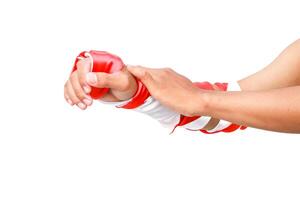 Close-up of hands and arm wearing a red and white striped sleeve on a white background photo