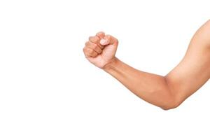 A clenched fist and forearm illustrate determination and strength on white background photo