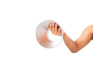 Arm holding a transparent textured empty bowl against a white background photo