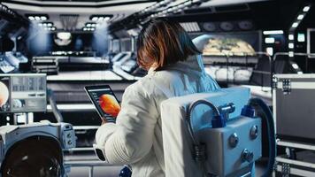 Astronaut navigates to red planet, doing human expansion in space to seek extraterrestrial life. Cosmonaut studying cosmic origins during mankind survival expedition to Mars, camera A video