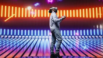 Cool modern guy showcasing artistic vibes with his virtual reality glasses, surrounded by colorful neon lights in a cyberpunk atmosphere for entertainment. Nightlife minimalism. Camera B. video