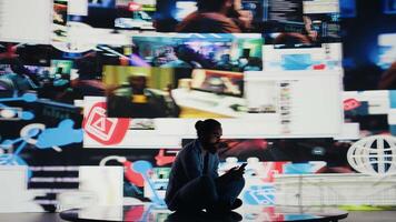 Caught in the toxic cycle of social media, disturbed man shows signs of social anxiety and obsessive behavior driven by excessive information online content, harmful smartphone dependence. Camera B. video