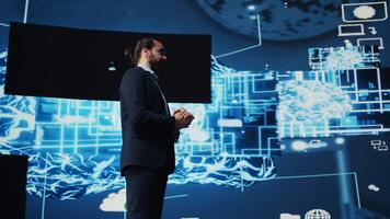 Entrepreneur presenter hosting live conference to highlight AI usage in business growth, demonstrating the use of neural networks system and machine learning. Fintech event. Camera B. video