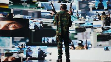Armed forces soldier gathers surveillance from digital drone systems, preparing for combat with warfare strategies and battlefield details. War planning operations in command center. Camera B. video
