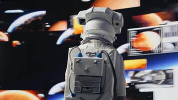 Male astronaut in a space suit floats in orbit above Earth, symbolizing journey of humanity into cosmos. Endless pursuit of discovery, technology and exploring the unknown universe. Camera A. video