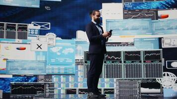 Business entrepreneur sending a text message with analytics reports, working hard on obtaining maximum performance for activity development success. Management and innovation. Camera B. video