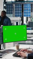 Vertical Sustainability expert evaluates solar panel systems next to mockup, working on production line in a modern industrial facility. Guiding operations toward clean energy efficiency. Camera A. video
