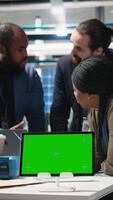 Vertical Diverse team members overseeing factory activity next to copy space, blending professionalism and technical expertise in the world of sustainable industrial energy. Cheaper power. Camera A. video