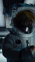 Vertical Cosmonaut verifying navigation coordinates on tablet, preparing for planetary mission outside. Astronaut conducting safety checks before beginning landing procedures on solar system planet, camera A video