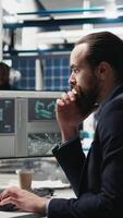 Vertical Professional consultant reviewing solar power quality in a factory, reviewing data reports and insight for seamless production line and sustainable solar energy. Photovoltaics industry. Camera A. video