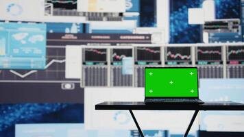 Empty business space has a laptop screen with chroma key, showcasing infographics and reports for effective decision making and strategy planning. Artificial intelligence brain. Camera B. video