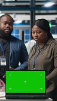 Vertical Team of consultants and factory analysts work with a copy space screen in the solar panel plant, ensuring every detail aligns with clean energy efficiency and solar tech innovation. Camera B. video