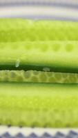 Enjoying fresh cucumber slices during summer meals video