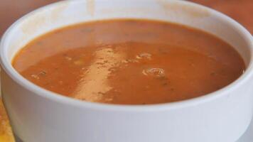 Delicious soup served in a warm bowl at cozy restaurant video