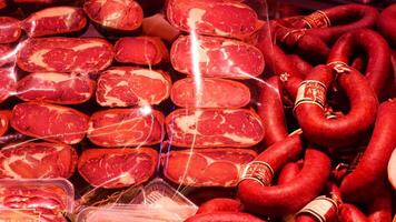 turkey istanbul 19 may 2025. Colorful arrangement of various meats at a market during evening hours. video