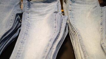 Styles of denim jeans on display in a retail setting video