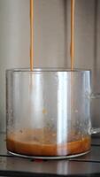 Freshly Brewed Espresso Pouring Into Clear Glass Cup on Coffee Machine video
