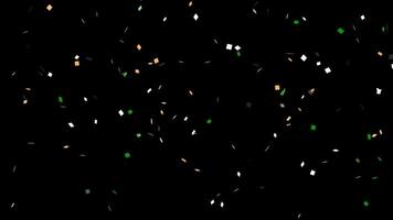 Irish tricolor confetti explodes from the bottom of the frame then double pops and falls glittering. Saint Patrick's Day celebration concept. Overlay with transparent alpha channel. video