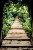 Wooden Steps Ascend Through Lush Green Garden Tunnel Leading to Forest Glade With Flowers And Trees photo