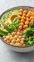 Bowl Filled with Quinoa, Chickpeas, Avocado, Edamame, and Basil, Balanced Meal for Health, Ideal for Fitness and Wellbeing photo