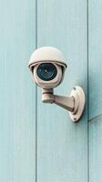 Security Camera mounted on a Blue Wall. Vigilance for Cyber Awareness. Surveillance equipment, concept for Digital protection and Security. photo