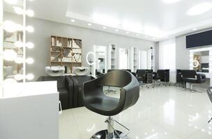 Modern empty hair saloon with chairs and mirrors, free space photo