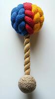 A rope toy with a colorful knitted tree photo