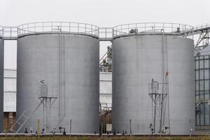 This agro-processing facility features several large silos designed for storing harvested grains. The silos are integral to grain storage and processing operations photo