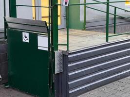 A well-constructed access ramp enhances entry for individuals with disabilities, showcasing thoughtful design elements illuminated by indoor lighting photo
