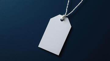 Blank white tag on a dark background photo