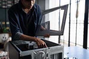 IT Engineer man is working on a computer case photo