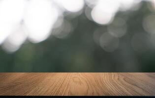 empty wooden table top with blurred background. photo