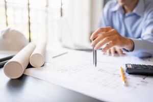 Architecture Man drawing on architectural Creative project business architecture building construction Industrial engineering Planning. photo