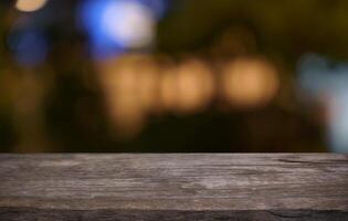 Empty wood table top and blur of restaurant background. photo
