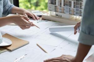 Architecture drawing on architectural working on a project with blueprints photo