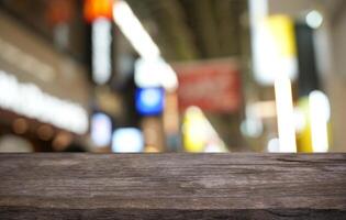 a wooden table top in front of a blurred background photo