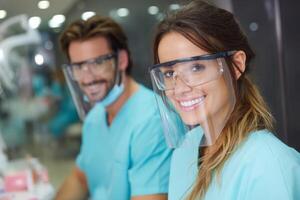 A smiling couple in dental masks photo
